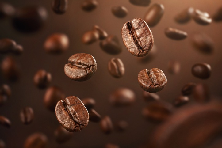 Roasted coffee beans falling down