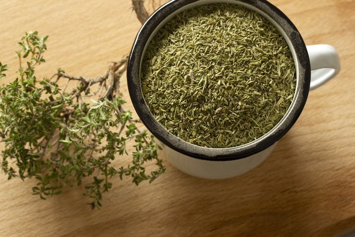 Dried crushed thyme on a table