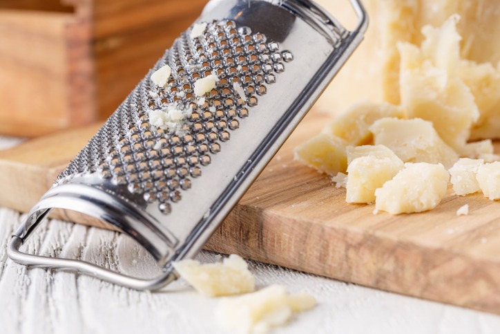 Parmesan on a dark background. Cheese pieces on close-up