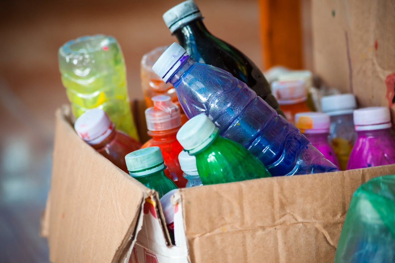plastic bottles in a cardboard box