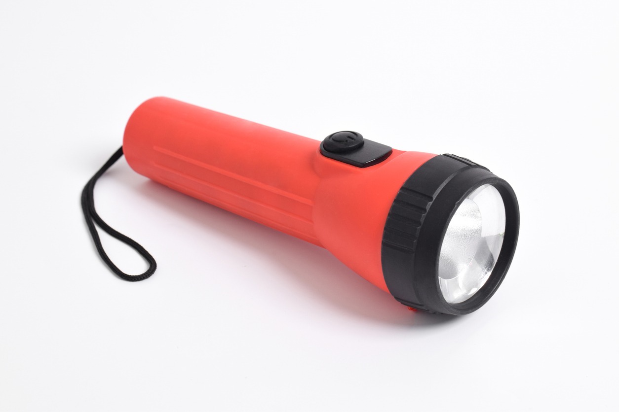Red color flashlight isolated on white background