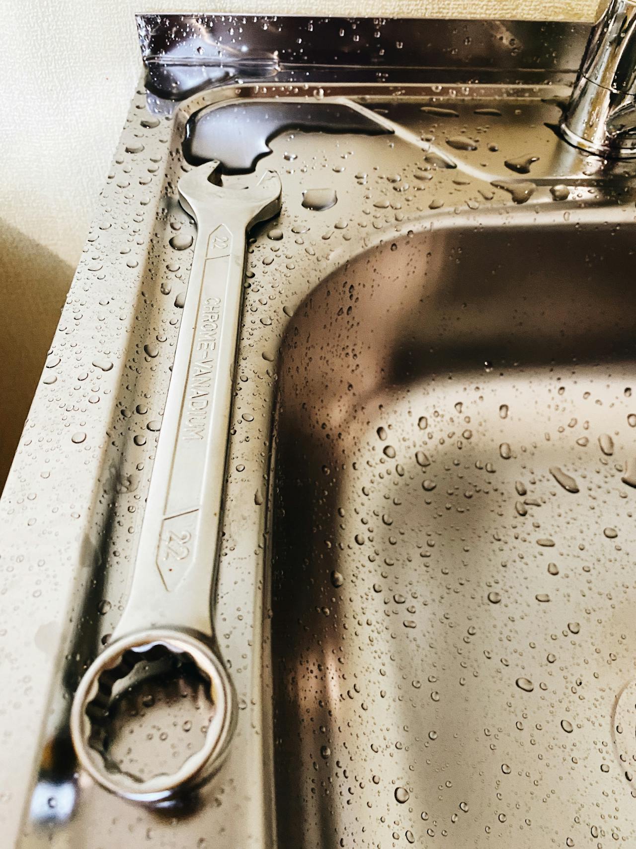 a wrench by the sink