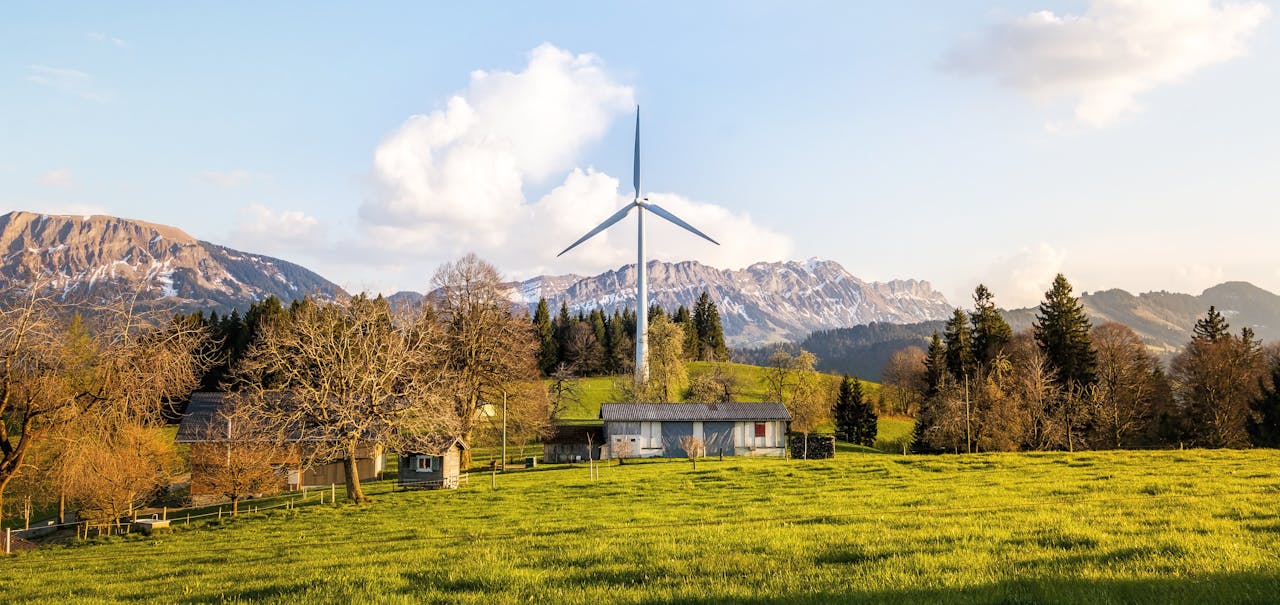 a farmland with a wind turbine