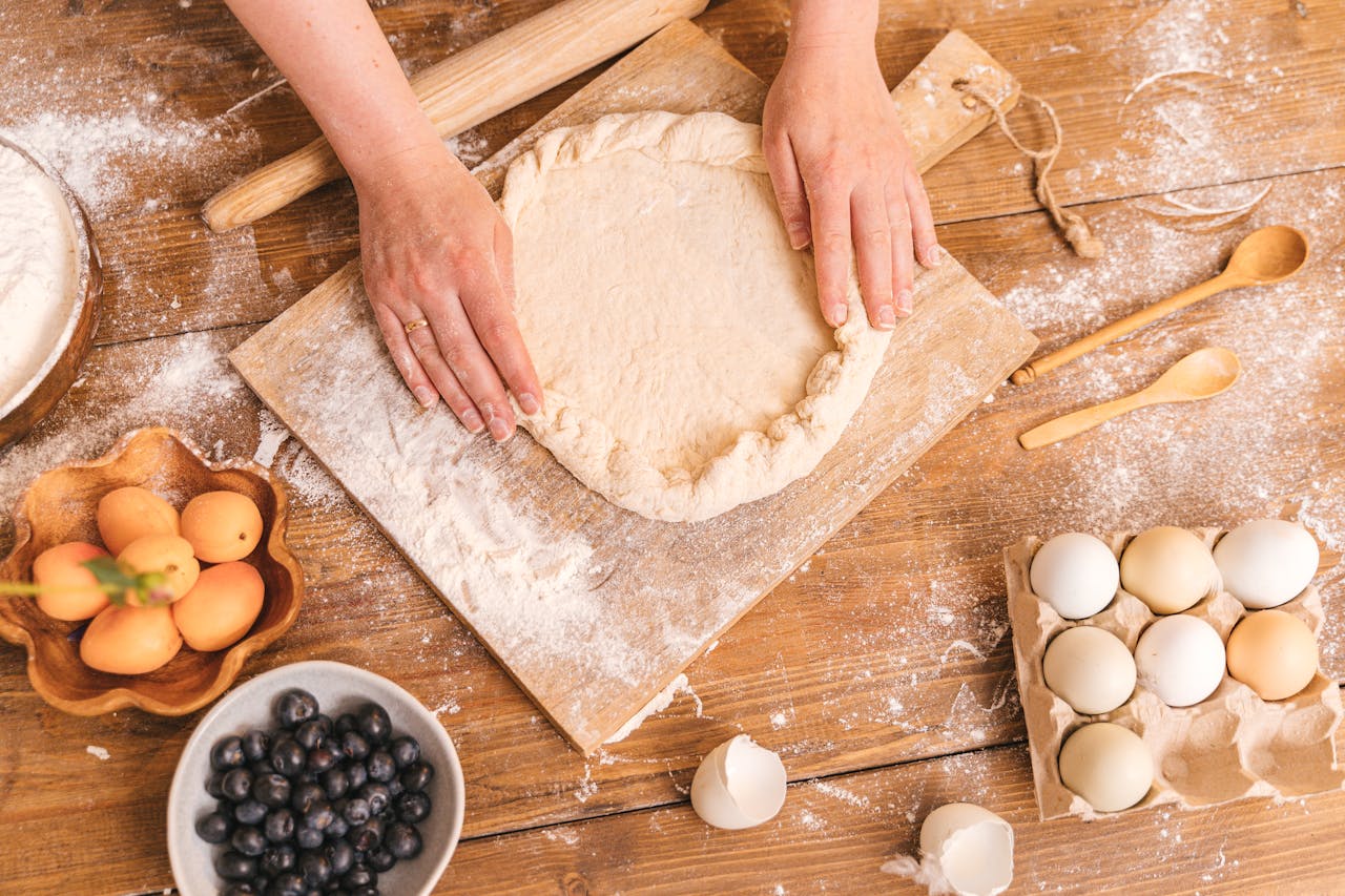 hands making a pie