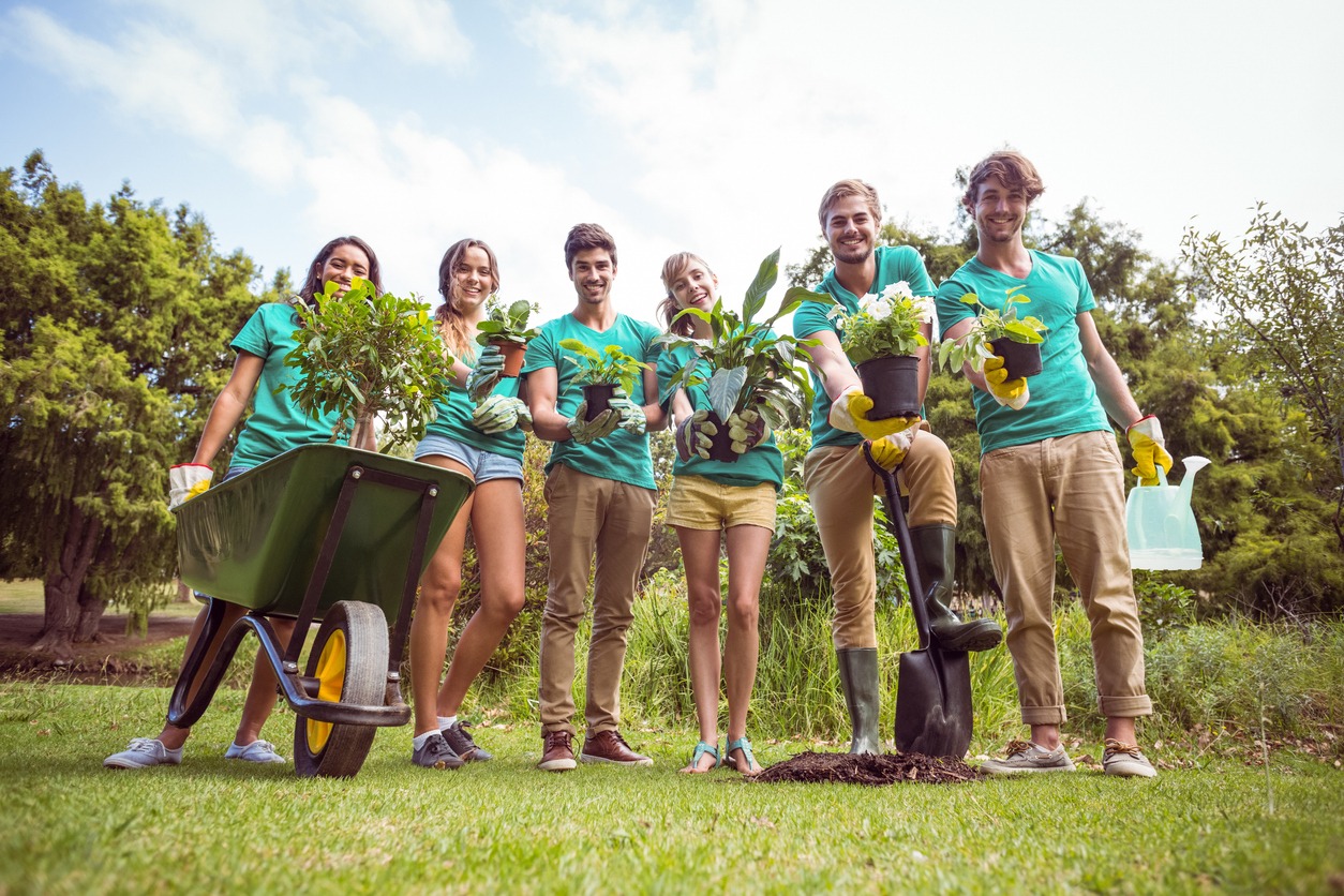 Happy friends gardening for the community