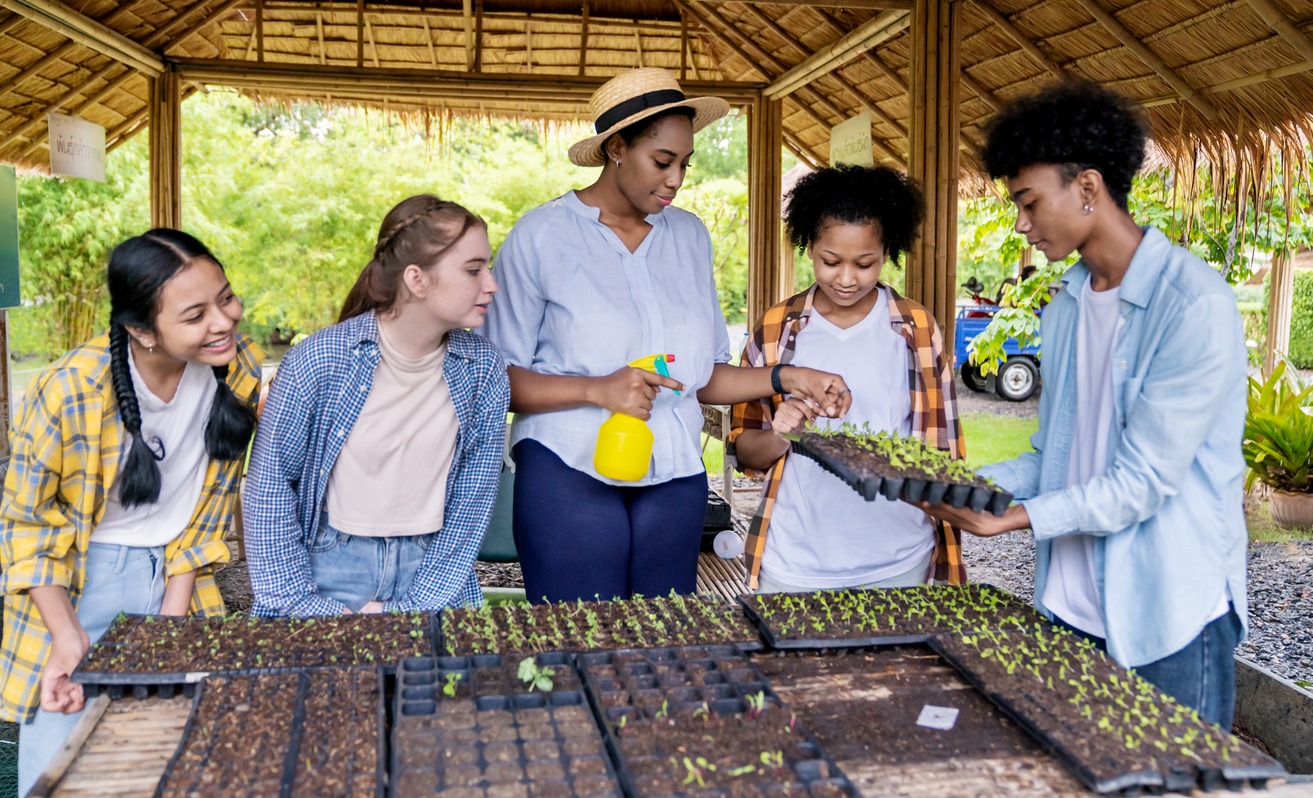 Group of teacher students teenager having outdoor lesson exploring nature