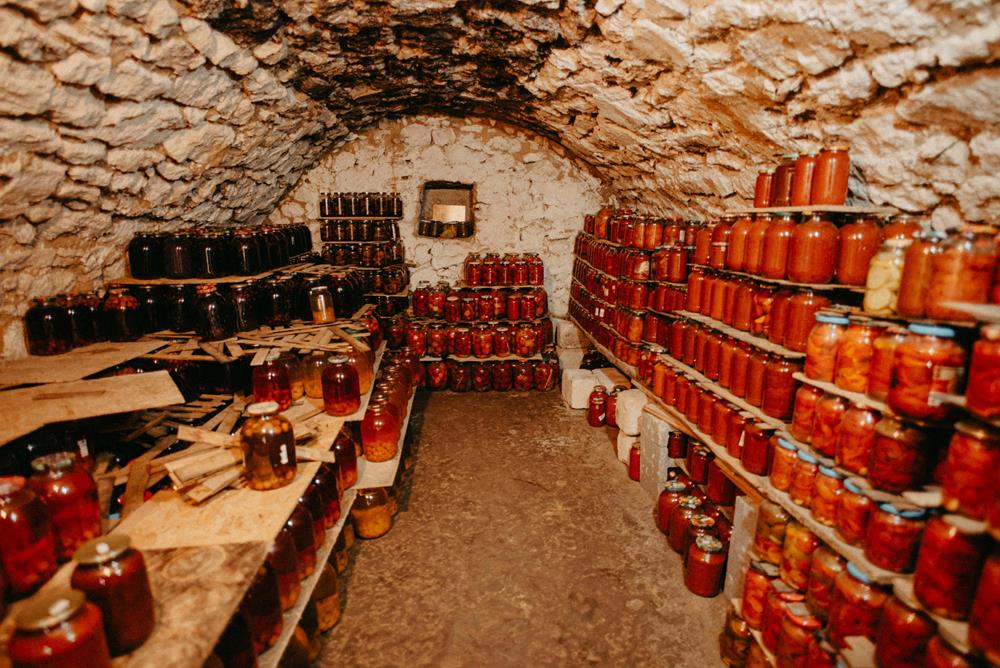 A root cellar with preserved jars of food