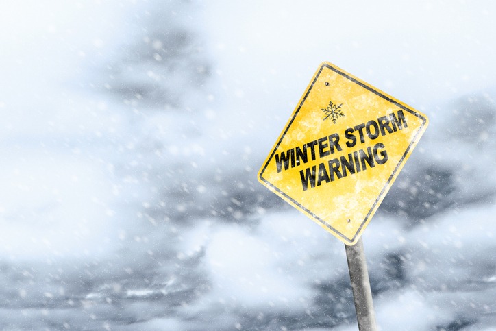 Warning sign saying winter storm warning